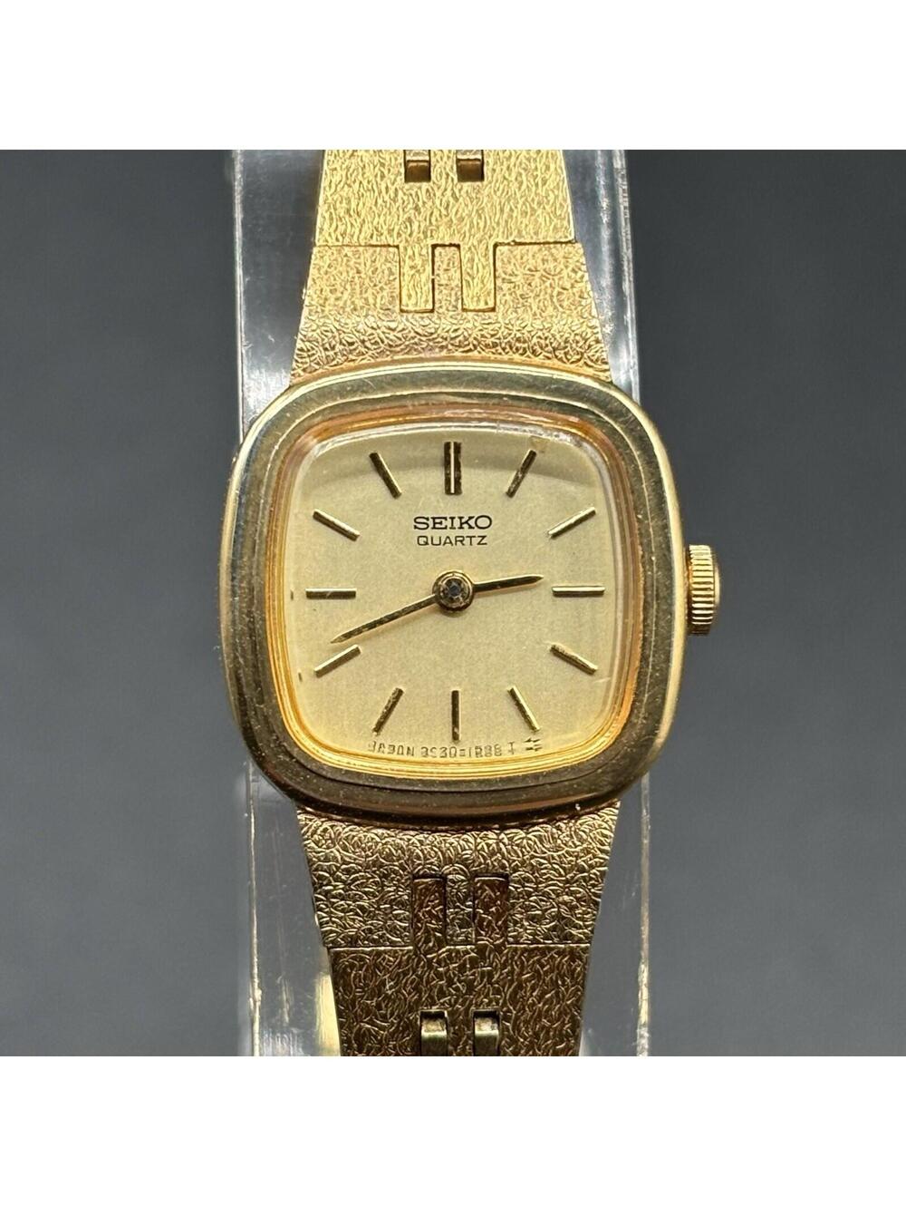 Seiko Ladies Gold-Tone Dress Watch Champagne Dial w/ Safety Chain 2C20-5739 Runs